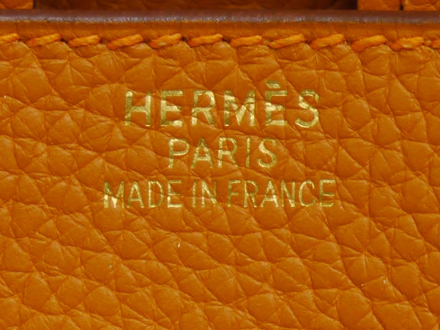 Hermès bag detail reference photo. Source: https://commons.wikimedia.org/wiki/File:Hermes-made-in-france.jpg; check source license. Not a confirmed Cargo Birkin image.